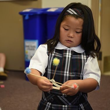 PLTW launch student engaged in a hands on STEM learning activity.