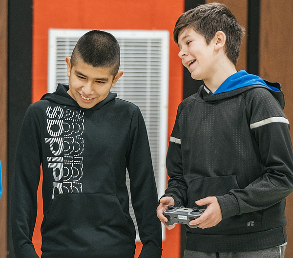 Two pltw students talking