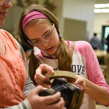 Two PLTW students engaged in a hands on activity.